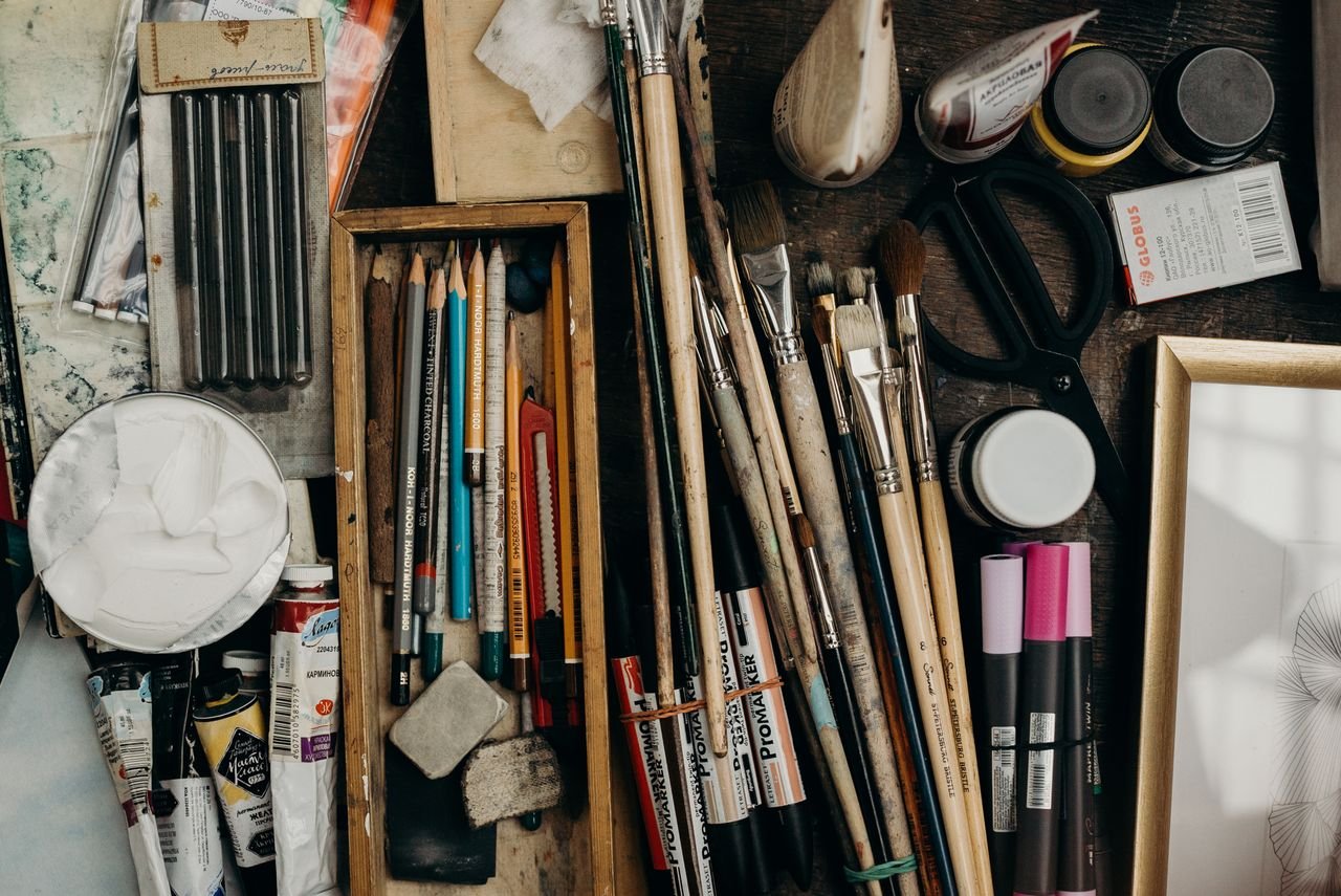 Mastering the First Impression: Your intriguing post title goes here Top view of various art supplies on a desk, showcasing creativity tools.